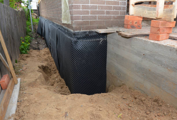 Happy homeowners after waterproofing job in Coalmont